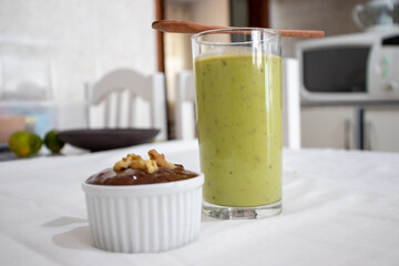 chocolate candy with nuts and green juice