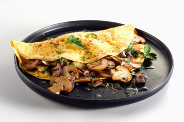 Yummy omelette with champignons on plate