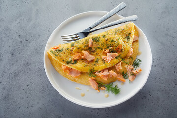 Plate with omelette and silverware