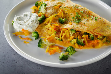 Broccoli and cheese omelette with sauce