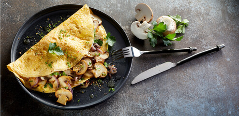 Appetizing omelet served on table