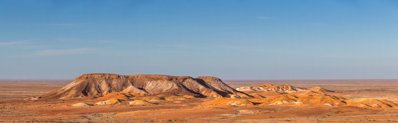 Panarama of 'The Breakaways' near Cobber Pedy, South Australia reflecting the colours of the hills as the sun sets.