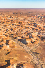 Fototapeta na wymiar Aerial view of the eroded land formations of the Painted Hills near William Creek in South Australia.
