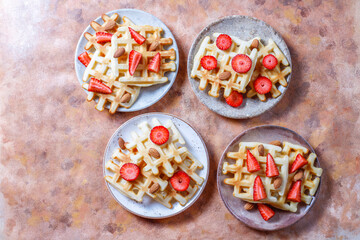 Homemade belgian waffles with strawberries.