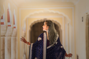 Woman in blue sari in the Taj Mahal, Agra, Uttar Pradesh, India