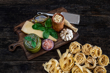 Fototapeta na wymiar Pesto sauce preparation on the wooden table