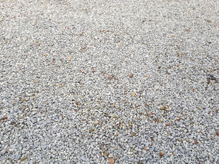 Gravel road texture. Small grey pebble pattern. Stone ground