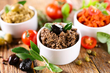 assorted of tapenade- black and green olive and tomato