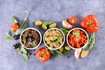 assorted of tapenade with olive, tomato and basil