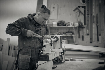 Woodwork and furniture making. Joinery, woodworking and furniture making, professional carpenter cutting wood in carpentry shop, industrial concept