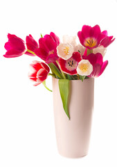 Many beautiful tulips with leaves in a glass vase isolated on transparent background. Horizontal photo with fresh spring flowers for any festive design