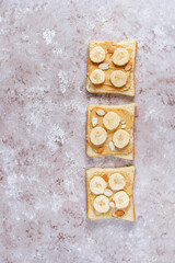 Sandwich with peanut butter and banana slices.