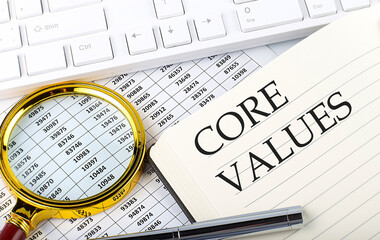 CORE VALUES text on notebook with chart, magnifier,keyboard and pen