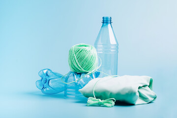 The concept recycling plastic. Empty plastic bottle and recycled polyester fiber, synthetic fabric...
