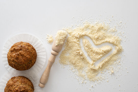 Gluten Free Baked Goods, Muffins On Almond Flour With Nuts On A White Background, Love Heart Symbol, Keto Food, Top View