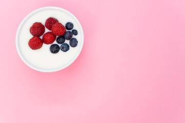 blueberries and raspberries in a yogurt bowl