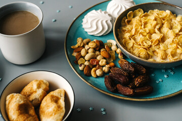 Bright breakfast on gray background, close up.