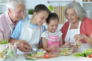family cooking together in kitchen
