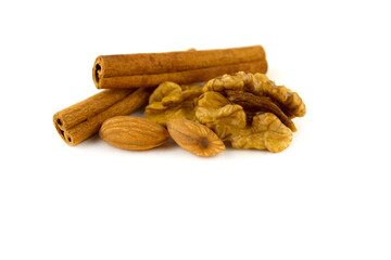 Walnut and almond seeds with cinnamon sticks