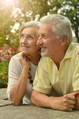 Happy senior couple posing outdoors