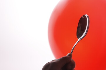 Person holding a spoon