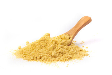 Powder mustard with wooden spoon isolated on a white background.