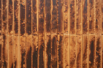 Texture of an old wooden wall with heavy signs of use as background image.