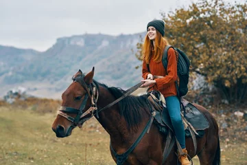 Foto op Canvas woman hiker ride horse mountains travel fresh air © SHOTPRIME STUDIO