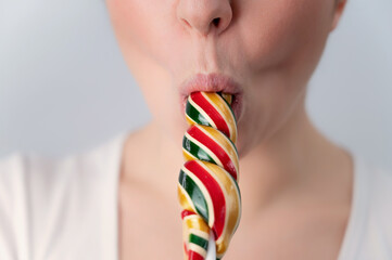  woman sucking a lollipop 