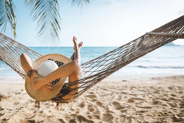 Foto op Plexiglas Traveler asian woman relax in hammock on summer beach Thailand © Peera
