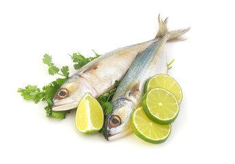 Two short mackerels with parsley and lemon isolated on white background.	
