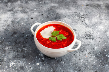 Traditional Ukrainian Russian borscht or red beetroot soup in the bowl.