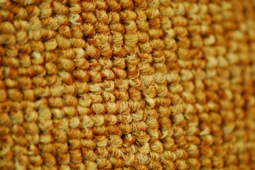 Close up of gold textured carpet