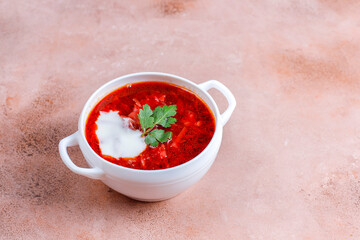Traditional Ukrainian Russian borscht or red beetroot soup in the bowl.