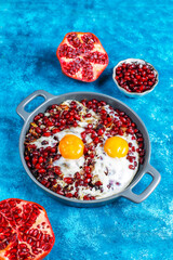 Traditional Azerbaijan cuisine pomegranate seeds with egg narnumru or nar numru.