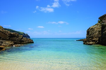 Fototapeta na wymiar Beautiful summer scenery. calm waves on the blue water. Yuhina Beach in Zamami island, Okinawa, Japan - 日本 沖縄 座間味島 ユヒナ 海岸 