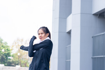 Portrait of beautiful young woman exercising on Running Track. female fitness model stretching exercise or warming up before work out. exercise, Fitness, workout, sport, lifestyle concept.