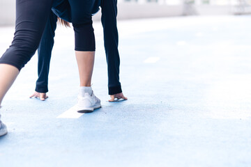 Close up selective focus Woman foot with sneaker on running track getting ready to start. exercise, fitness, workout, sport, lifestyle concept. Goal of business. Forward to Success concept.