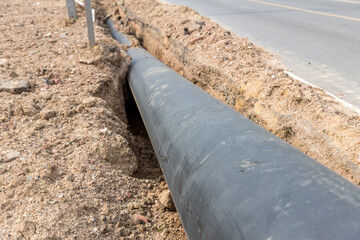 Construction site with new Water Pipes in the ground. sewer pipes to repair or restore in street...