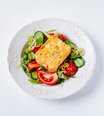Fried feta cheese with tomato salad