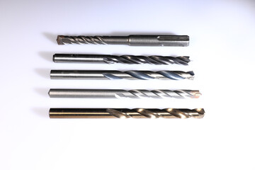 Set of various drill bits with white background
