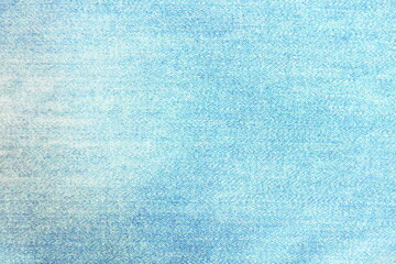 Obraz premium Blurred focus of blue jeans with texture in pastel blue tone for background and decoration