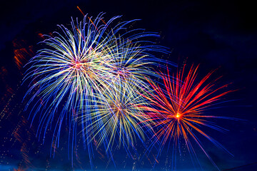 Fireworks on the background of the dark night sky. 4th July - American Independence Day