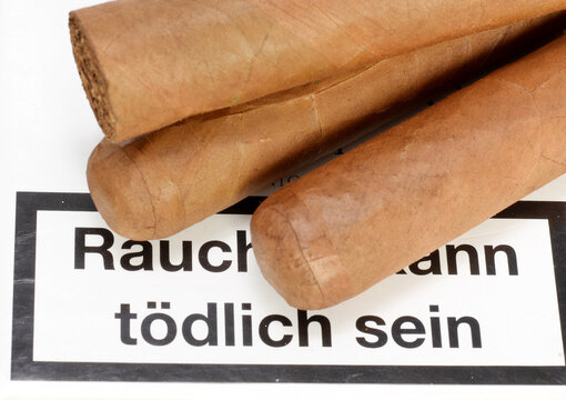 Cigars On White Tobacco Box With Text Warning Message On German Language 