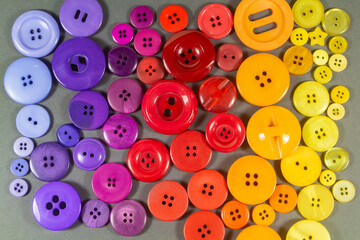 Fototapeta premium Color gradation from blue to yellow made in sewing buttons