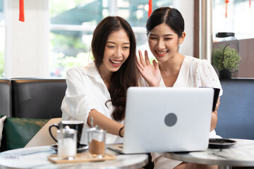 young couple woman talking and using laptop computer in free time