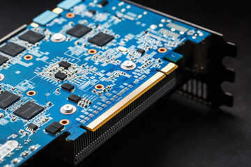 Chips and microprocessors on the blue Graphics card board.
