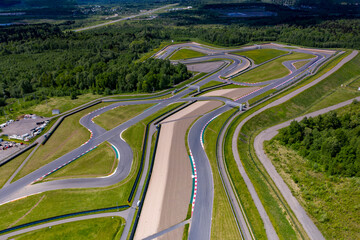 a panoramic view of the avodrome for racing in sports cars before the races on a sunny day filmed from a drone 