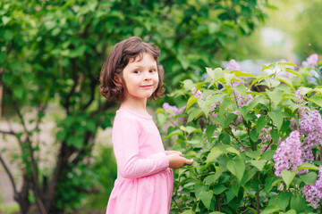Portrait of smiling cute little girl child in summer day outdoor
