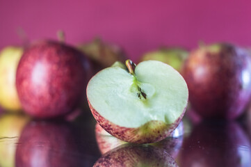 apples on a red background